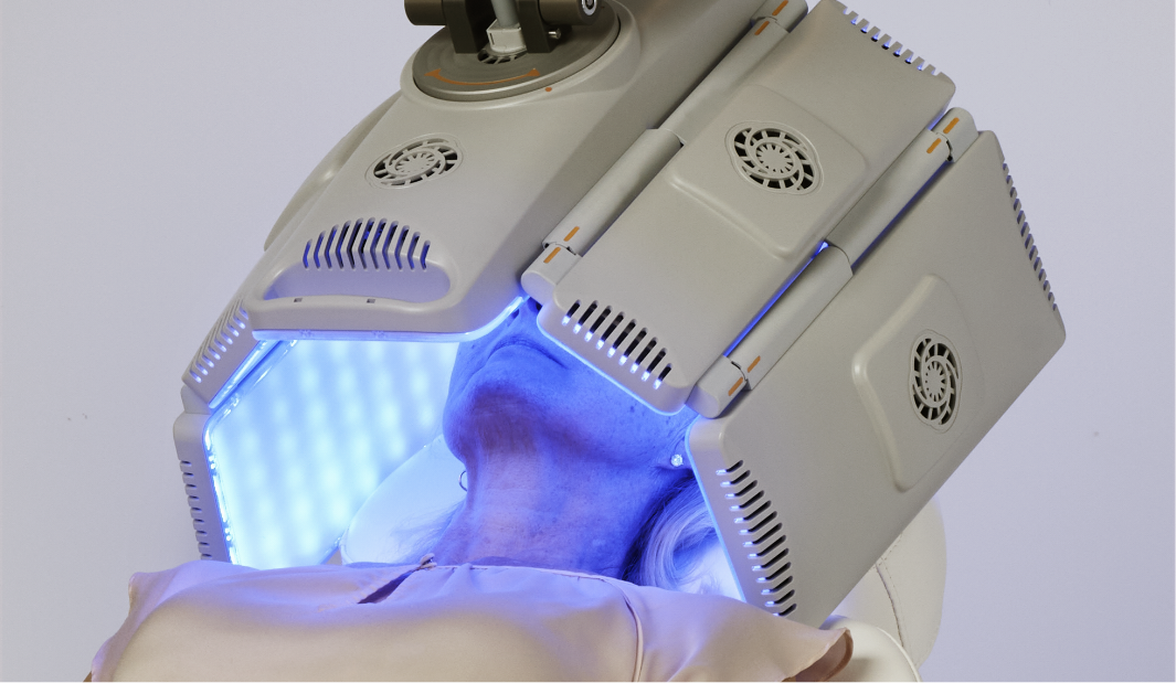 Hands receiving blue light treatment